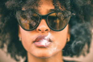 A woman wondering, "Is weed addictive?"