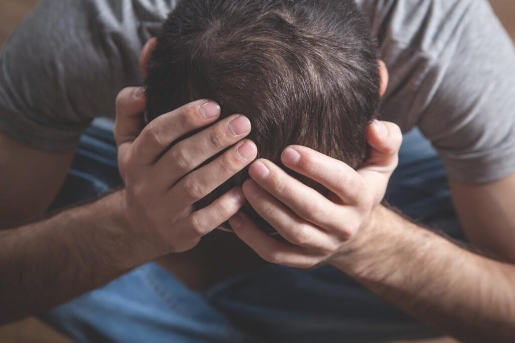 Man thinking about the consequences of being Baker Acted