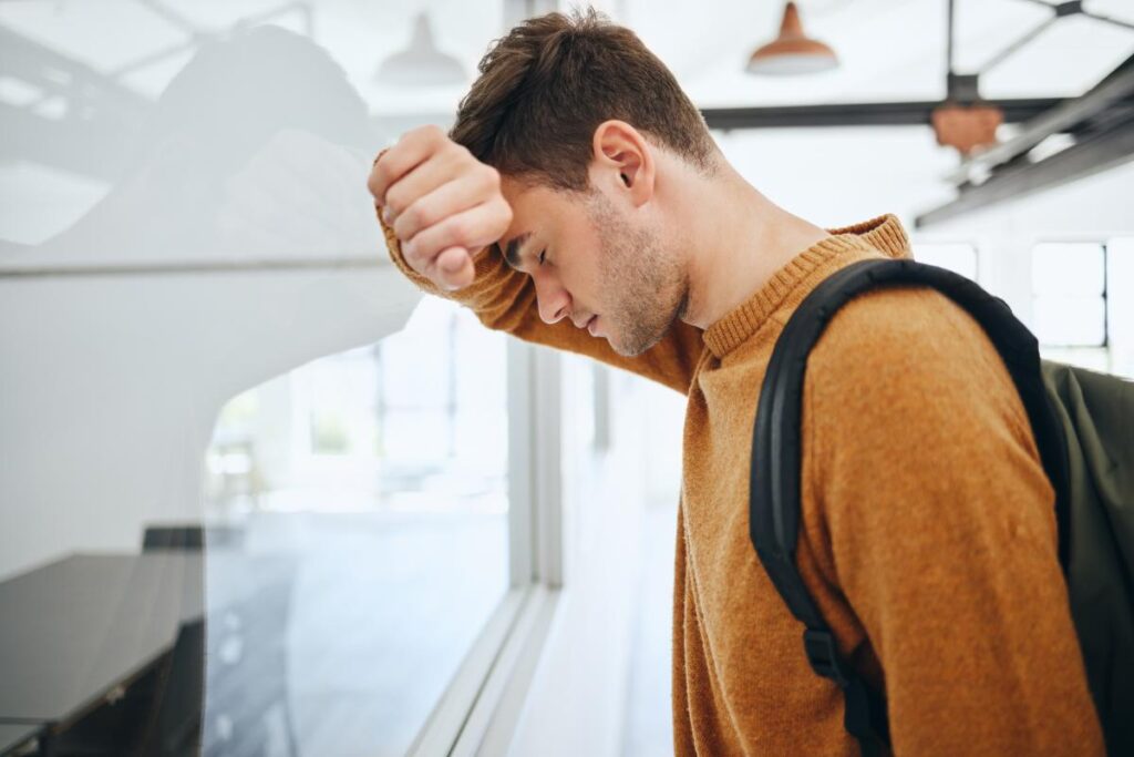 A man wondering, "How long does it take to get addicted to alcohol?"